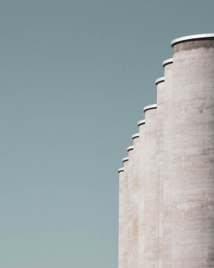 Concrete grain silos against a clear sky